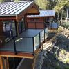 Port Renfrew home with glass & aluminum fascia mount deck railings