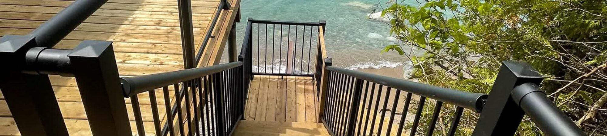 Picket stair and glass deck railing combo with Century's versatile aluminum railing posts