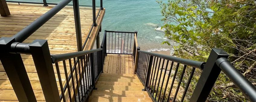 Picket stair and glass deck railing combo with Century's versatile aluminum railing posts