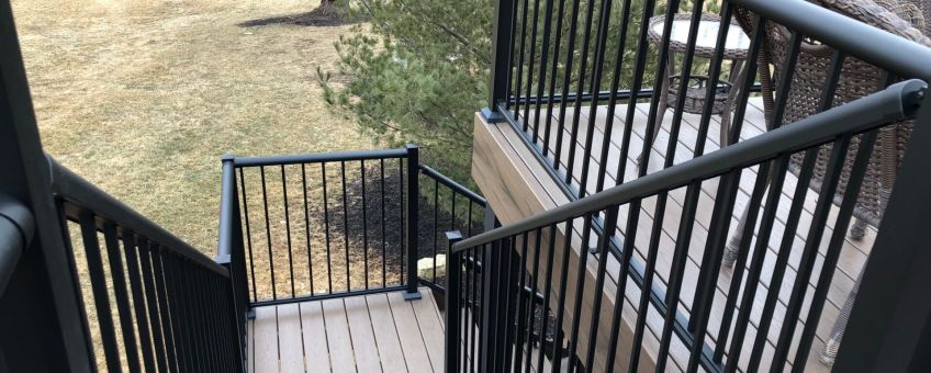 Staircase with black aluminum picket railings