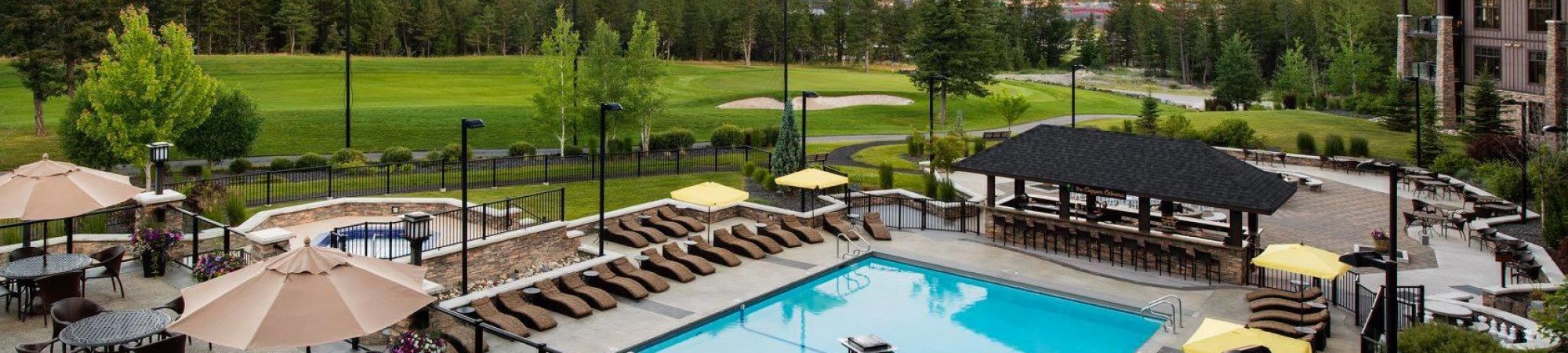 Powder Coated glass and picket aluminum railing surrounding a swimming pool - Copper Point Resort