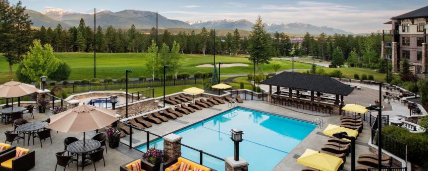 Powder Coated glass and picket aluminum railing surrounding a swimming pool - Copper Point Resort