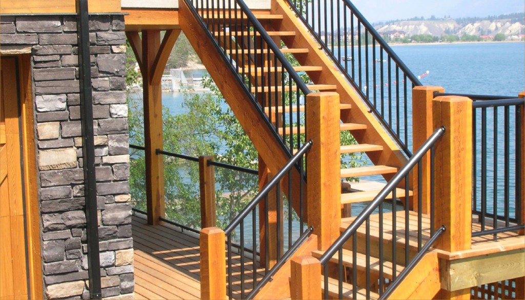 Black aluminum picket railings with wood posts