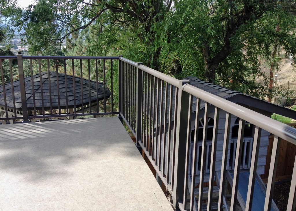 small deck with a fascia mount railing