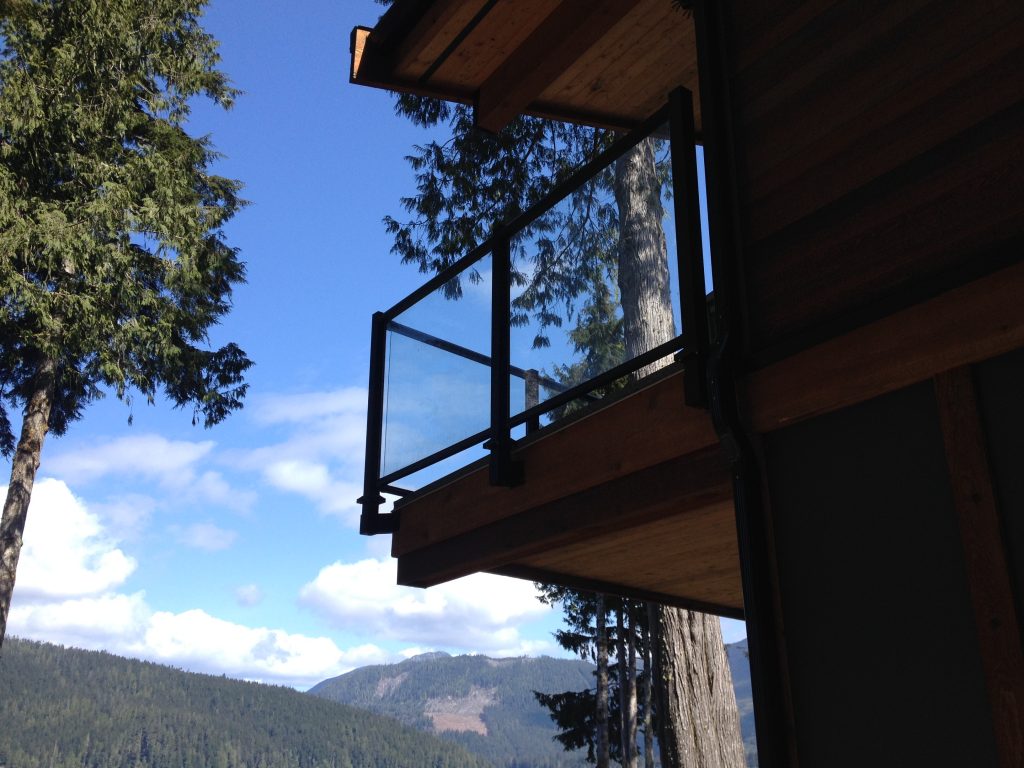 Glass deck railings with fascia mounting system