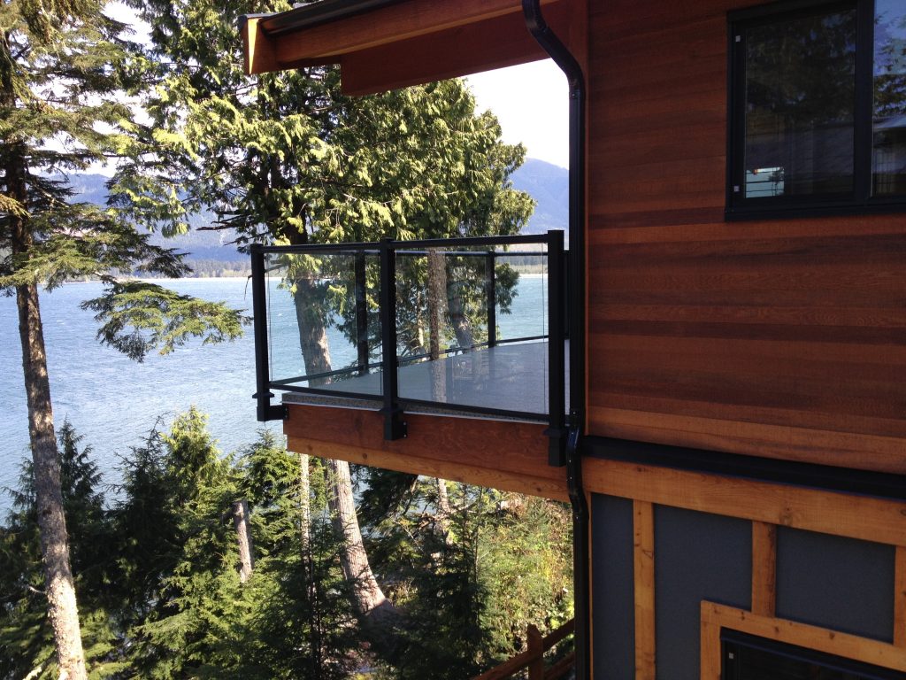 Photo of glass deck railings with fascia mounting system