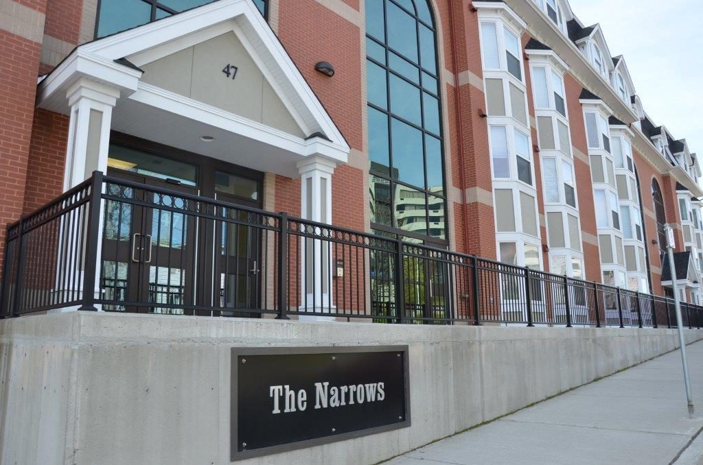 The Narrows commercial building with black picket railings