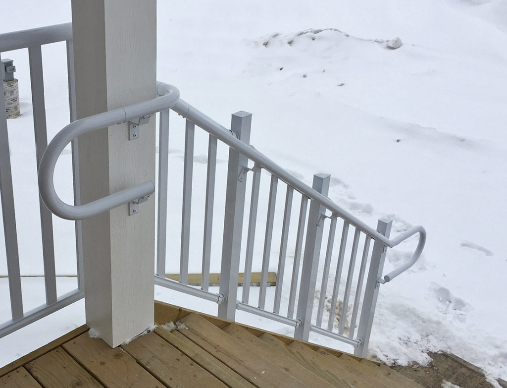Staircase with pipe Railing with rounded end for added support and safety