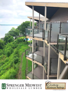 Commercial Project  Style Used: Glass Railings, 3” Custom 45-Degree Posts and Custom Tinted Glass Color: Textured Black Location: Bridges Bay Resort in Arnolds Park, IA. Located on one of the last large strips of available beachfront on the shore of East Lake Okoboji, Bridges Bay Resort saw the need for expansion in 2016. This year-round resort features individually-owned condominiums and hotel-style guest rooms for short-term or long-term rental with beautiful outdoor patios and decks finished with Century Aluminum Railings.   "The views from the decks and patios are incredible,” says Todd Kappenman, Senior Regional Accounts Manager at Sprenger Midwest. “The glass railings by Century Aluminum Railings were a perfect choice to use for unobstructed deck views all while meeting safety requirements.”    In addition to the glass railings, textured black, 3” custom 45-degree posts and custom tinted glass were installed. Contributor: Sprenger Midwest