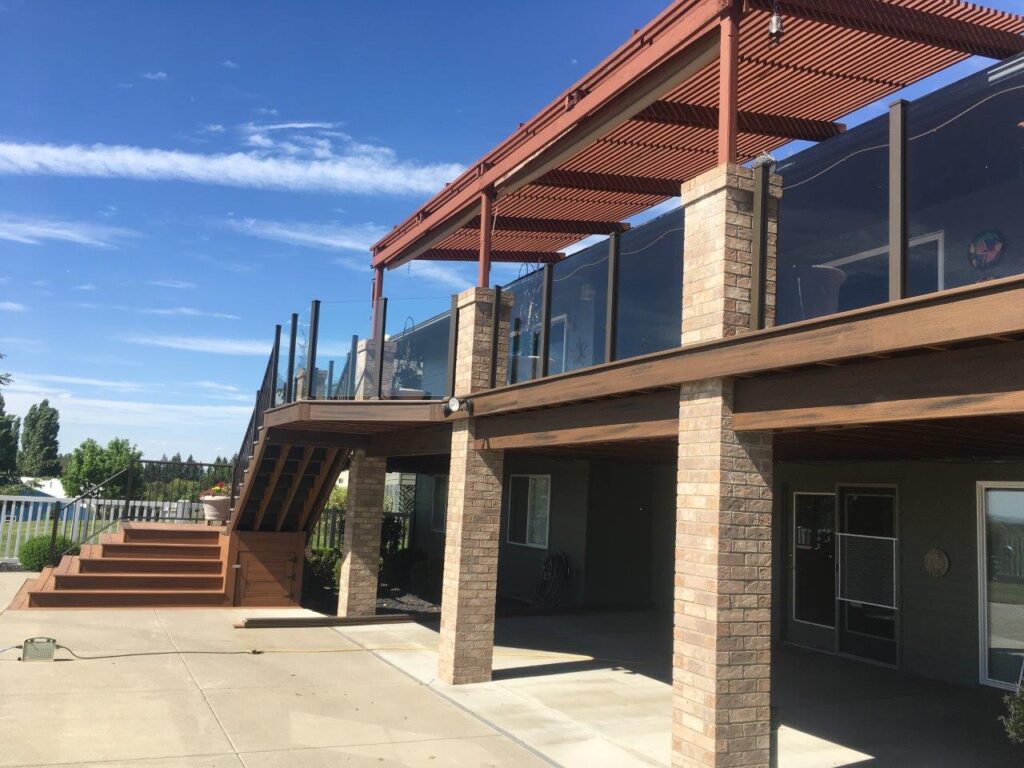 Tinted glass railings with pickets on stairs