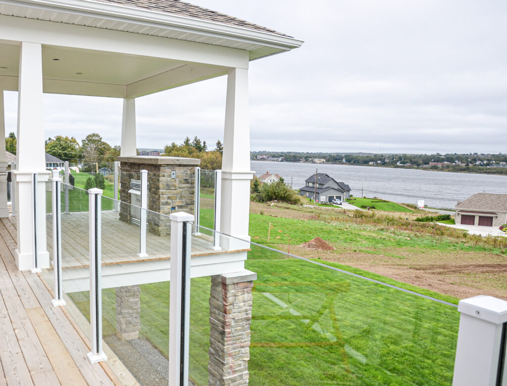 Scenic Railing on deck of large white home
