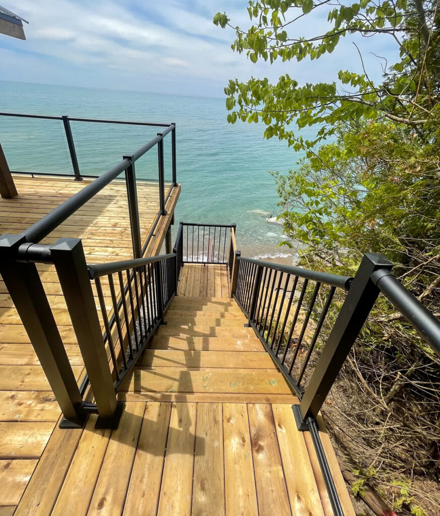 Picket stair and glass deck railing combo with Century's versatile aluminum railing posts