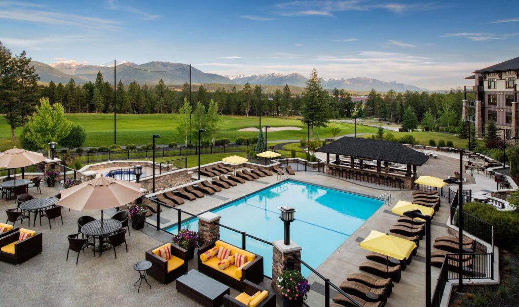 Powder Coated glass and picket aluminum railing surrounding a swimming pool - Copper Point Resort
