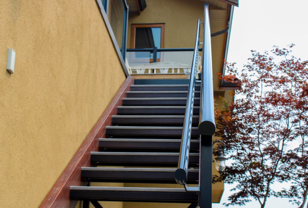 Front view of a staircase with Century Aluminum Railings Pipe Railing System