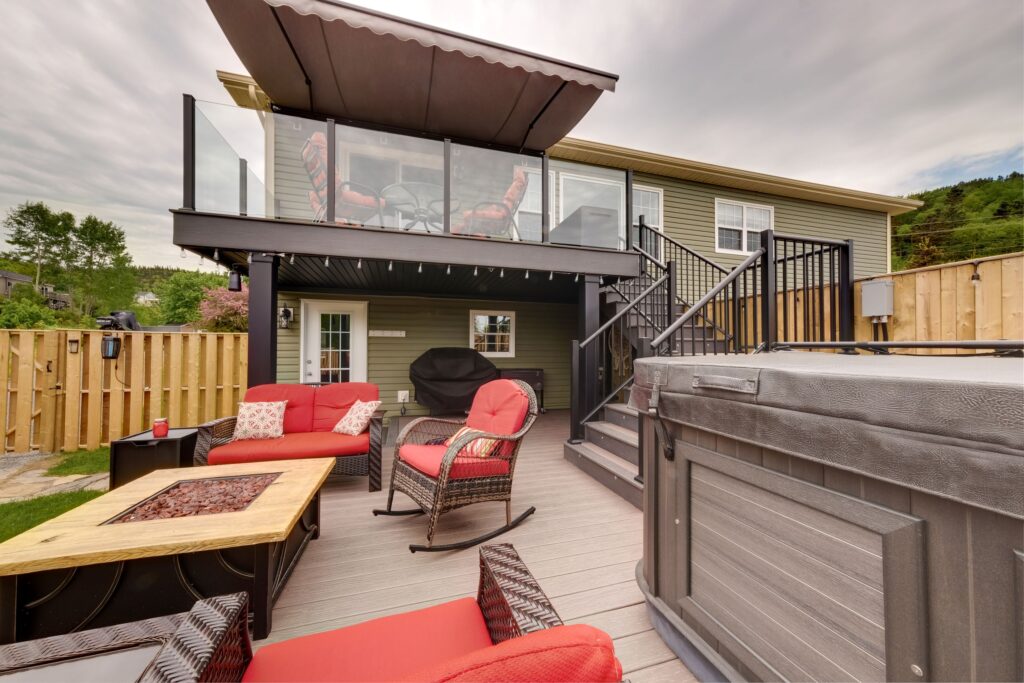 A cozy backyard with glass and picket railings