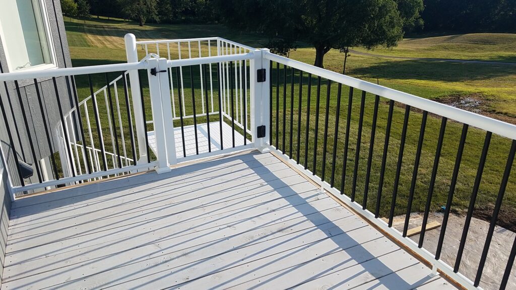 Black Picket Railing with white top and bottom rails by Sprenger Midwest contacting